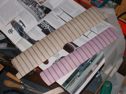 Fokker D7
The Jap tissue has been sealed around the wing with PVA adhesive,once everything is done the trailing edge wing scallops produced by the piano wire bending with the dope shrinking will be simulated.
