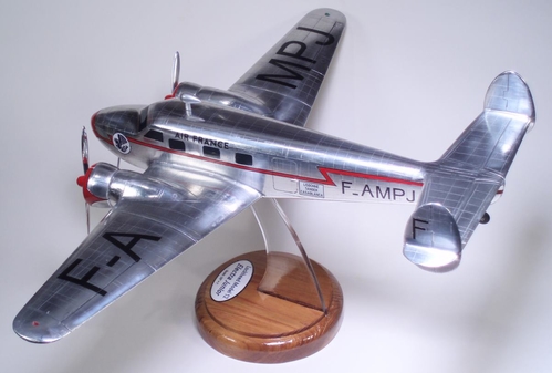 Lockheed 12 Model
3/8" = 1' scale ("1/32 Scale") solid model.  Model constructed of aspen, wood grain filled with polyester resin as used in fiberglass construction.  Model details made from epoxy castings, acrylic sheet and aluminum.  Markings are a combination of waterslide decals and stencils.
