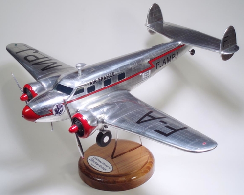 Lockheed 12 Model
3/8" = 1' scale model Lockheed 12 Electra Junior.  Model is based on drawings appearing in 1930's Popular Science magazine.  Constructed of Aspen.  Covered with aluminum foil using metal leaf adhesive size.

