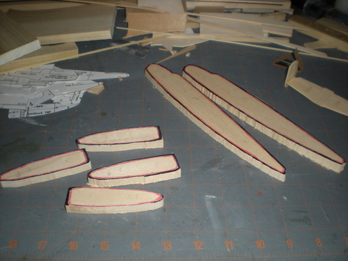 b25017
Parts cut out and ready for drilling.  I use red ink inside the outline to show me I am cutting too much.  Black ink outside says keep cutting and helps me see the line.  Peg locations are marked for drilling.
Keywords: B-25 Mitchell Doolittle Tokyo Raider
