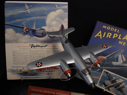 Here is another view that shows the Charles Hubbell painting used in a Martin Aircraft ad.
