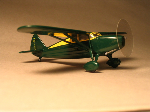 1946 Fairchild 24R 
1946 Fairchild 24R model in 1/72 scale. Built in 2006 in the colors of an aircraft owned by a friend. I thought the green and yellow would make a nice colorful addition to my collection.
