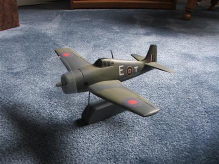 Lou's Hellcat
Completed in Royal navy Fleet Air Arms colours of dark slate, dark ocean grey and medioum ocean grey. Home decals paterned after a profile found on line rounded out my first on line cook up.
Keywords: Solid Model Memories SMM Grumman Hellcat Aircraft  Wood Carving Scratchbuilt