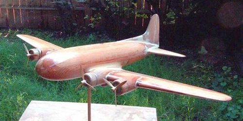 1940 TWA Stratoliner Restoration
Wings were laminated up of five planks of pine, engine nacelles of three. Model was reasembled using epoxy glue and the filler used was PC Woody, a wood epoxy paste. A lot of filler was used in the original construction as in the restoration. New propellers were carved based on the Smithsonian model photos and Paul Matt's Stratoliner drawings
Keywords: SMM Solid Model Memories Wood Carved Aircraft
