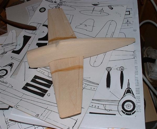 Balsabasher's Hellcat
Here a bit of fuselage shaping has taken place,the wing is slipped into place to check it out,and above all see what she looks like 
Keywords: SMM Grumman Hellcat Aircraft Solid Model Wood Carving Scratchbuilt