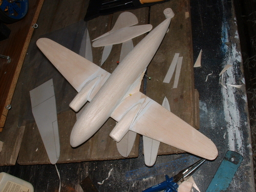 Curtiss Commando.
Another view of the assembled wing with the tail components all ready in the background.
Keywords: solid models,carved aeroplanes,vintage model building,balsa wood models,scale models scratchbuilt