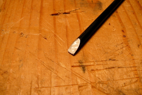 Chisel after honing
Here is the 1/8-inch chisel after honing the bevel and the back side on stones.  The edge developed a slight skew which I should be able to work out with the next sharpening.  You can see the wire edge in this photo, which I removed when I stropped the edge on leather coated with jeweler's rouge.  It is sharp enough to shave (slowly) with.
Keywords: chisel toolmaking