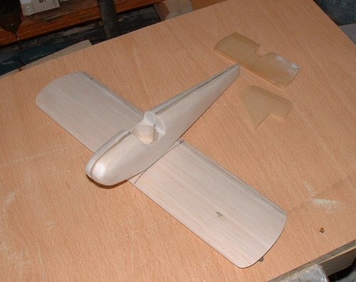 Fairey (Tipsy) Junior
Parts of the Fairey Junior just prior to cutting the wings into two halves ready for brass rod inserts to be glued into place.
I have a tiny two cylinder engine and propeller already made up to fit onto the nose.
Keywords: FAIREY (TIPSY) JUNIOR MONOPLANE,Solid models,carving models in wood,Solid model memories,old time model building,nostalgic model building