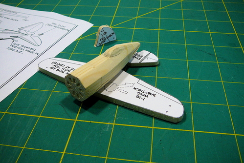I-16 ID Model parts
Here are the parts for the I-16 model.  I'll be building this as an ID model, straight from the WW II plans published by the US Navy.  I used a 1/8-inch chisel to cut in the intakes on the front of the engine, and then rough-carved the fuselage with a knife and gouge (for the turtledeck behind the canopy).
Keywords: Polikarpov I-16 ID model solid airplane