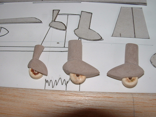 Making the wheel spats from synthetic wood and vintage buttons.
Keywords: POTEZ 75 Solid model,balsawood,carved models,Solid Model Memories,carving in wood.