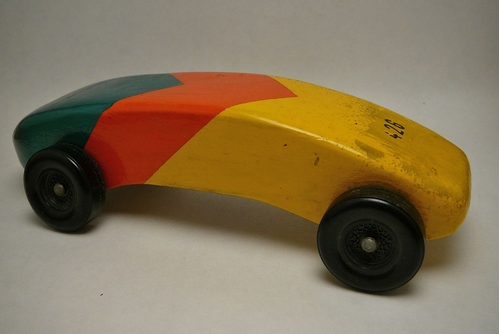 Pinewood Derby Car
My parents found my Pinewood Derby car in their attic.  I built this when I was I was 12 years old.  It is finished with airplane dope.  If I remember correctly, the shape comes from a concept car featured in Popular Science magazine.
Keywords: pinewood derby car