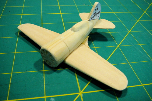 I-16 rough assembly
The fuselage and wing are almost completely shaped.  I tacked on the vertical stabilizer for the photo.  Just before this photo, I glued on the pieces to hold the wing fillets.  I used thin basswood rather than the cardstock recommended in the WW II ID model guide.  The cardstock frays and makes a mess as you sand it.
Keywords: polikarpov I-16 solid id model airplane