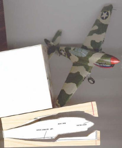 Ryan Short Collection
This is a scanner picture (hence the distortion) of a P-40 that I built for my sister. The markings are bogus and the finish is kind of yucky, but I enjoyed building it. Also learned that acrylics don't provide the smoothest finish. The landing gear and pitot tube are the only non-wood items on the model
