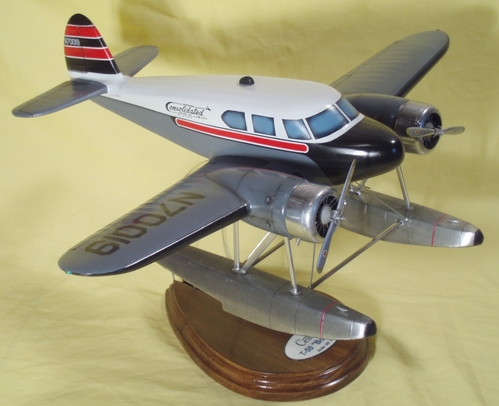 CessnaT50_TopRight
3/8" = 1' ("1:32 Scale") Cessna T-50 Bobcat.  Model is made from clear aspen; floats are pine (from a 2 X 4).  Sealed using fiberglass resin.  Painted with enamels; floats and cowlings are covered with aluminum foil.  Struts are flattened 1/8" aluminum tubing left in its' natural color.  Engines are epoxy castings.  Propellors and other small details are made from styrene.  Stand is pine and 3/8" plexiglas acylic. 
Keywords: Cessna T-50 Carved Solid Wood Model