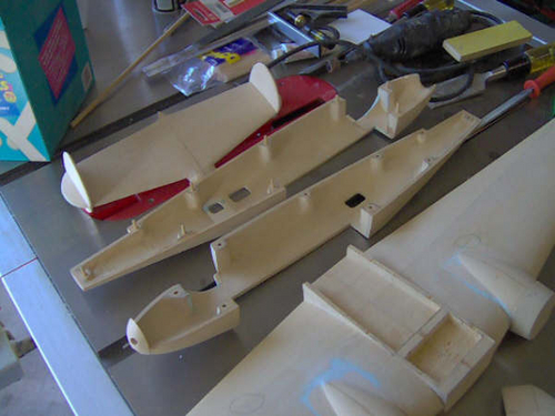 Lockheed 10 A by Vern koenig
  I did not turn the cowlings on my wood lathe....instead, I made them in sections. First a ring with a 1/8" wall was cut out on my bandsaw and then I used a disc sander to turn the outside smooth. Next, I used a 1-1/2" forstner bit to hog out the inside and then turned it smooth on a spindle sander. I repeated the process for the front of the cowling and glued them together. 
Keywords: SMM Solid Model Memories Wood Carved Aircraft