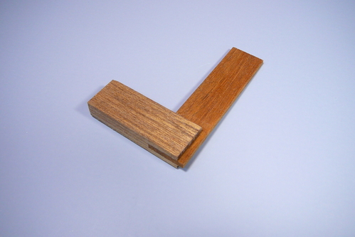 Wooden try square
A small wooden try square that I made using instructions in [i]Tool Making Projects for Joinery and Woodworking[/i] by Steve Olsin.  It is only 2 x 3 inches, designed for small model projects.  I made the blade out of 1/8-inch mahogany and the rest out of 3/8-inch mahogany baseboard salvaged from a remodel (Lou taught me this).
