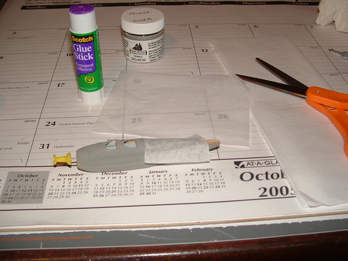 fleet10
Applying tissue to the fuselage.  I used gluestick to glue it down.  The purple stuff is good to see where the glue is applied.  It dries clear.  I used Model Shipways gray for a primer.
Keywords: fleet scratchbuild