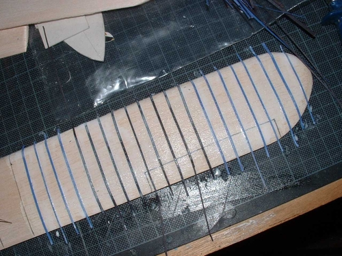 Sikorsky S-38 Amphibian
Wing ribbing represented with sugar paper strips glued to the wing,then a layer of tissue is doped across them.
Keywords: SIKORSY S-38 EXPLORERS YACHT,Solid models,carving models in wood,Solid model memories,old time model building,nostalgic model building