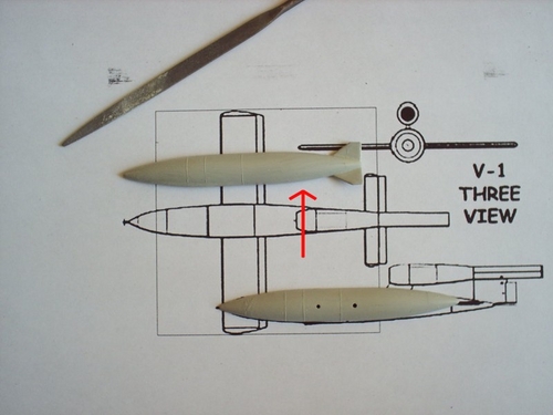 Planning the cut in the drop tank to make the V-1 fuselage. I used a spare part from a plastic kit.
