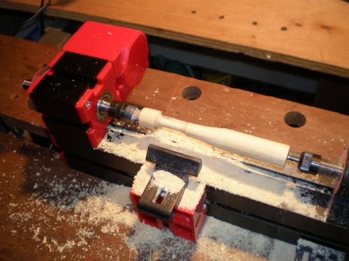 Using a mini-lathe to turn the V-1 motor.
